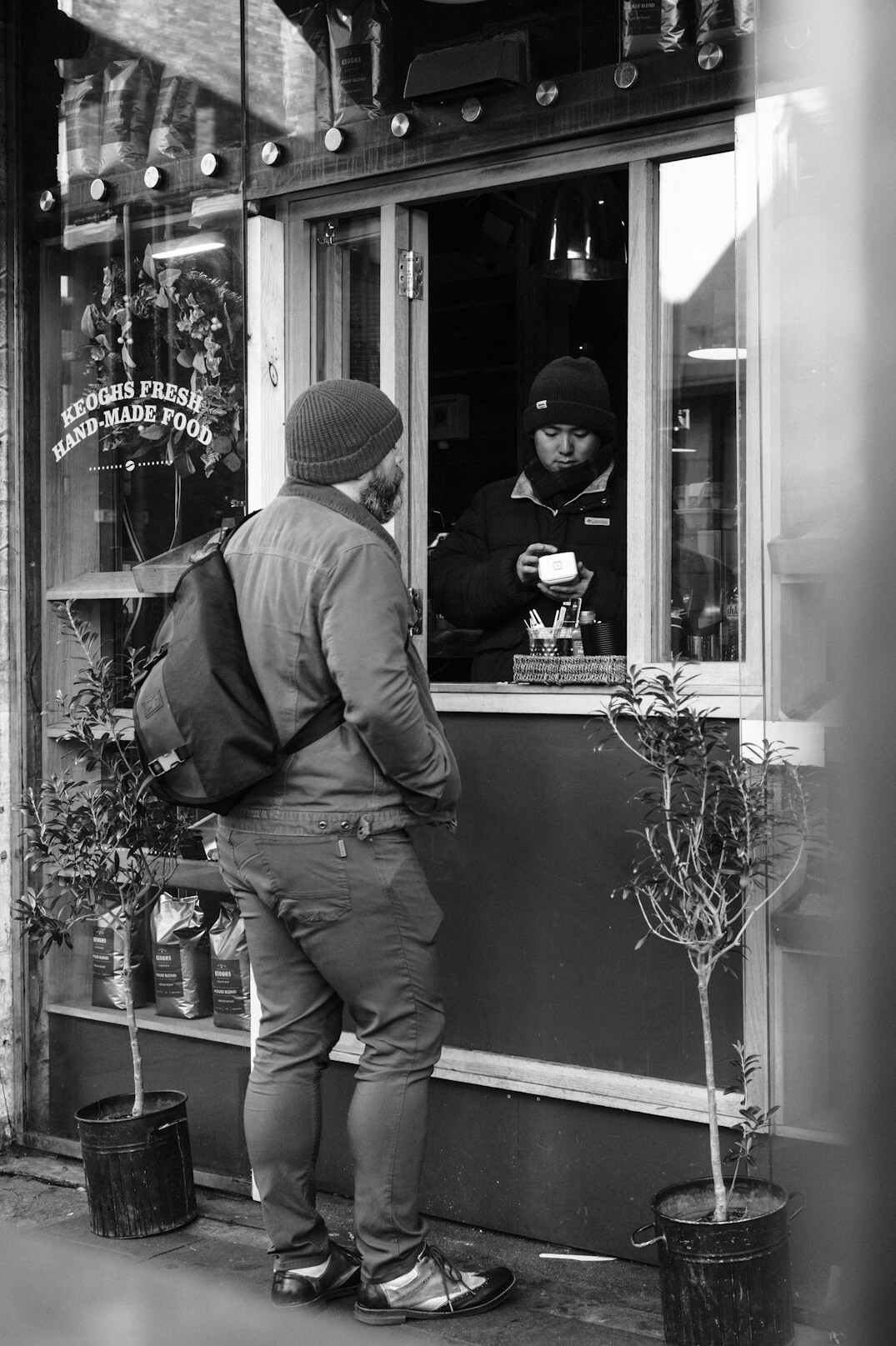 detective monitoring store entrance