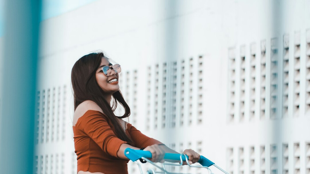 woman pushing shopping cart